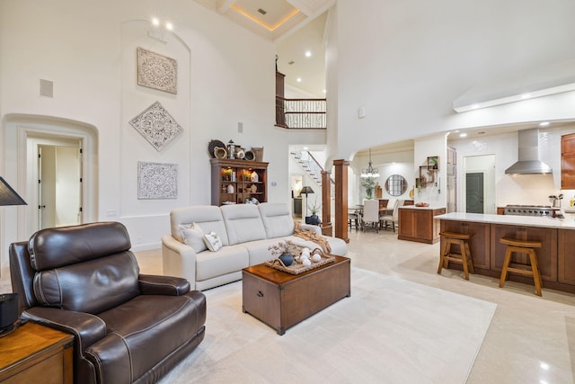 69 Cobalt Ln, Miramar Beach, FL 32550 - living room featuring a towering ceiling, stairway, arched walkways, and recessed lighting