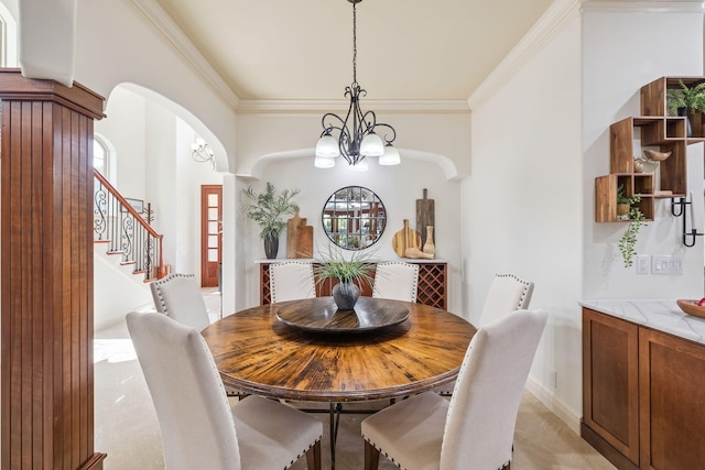 69 Cobalt Ln, Miramar Beach, FL 32550 - dining area with arched walkways, crown molding, stairway, and a chandelier