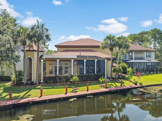69 Cobalt Ln, Miramar Beach, FL 32550 - rear view of property with a water view, a tiled roof, and stucco siding