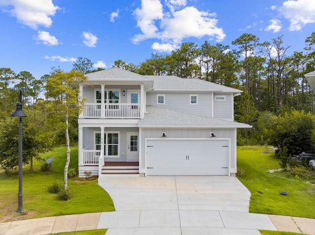 70 Oakley Ct, Santa Rosa Beach, FL 32459 - view of front of home with a balcony, a porch, roof with shingles, a front lawn, and concrete driveway