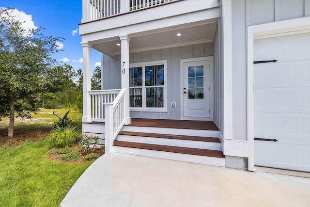 70 Oakley Ct, Santa Rosa Beach, FL 32459 - entrance to property with a porch, board and batten siding, and a garage