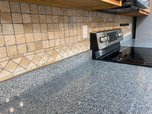 64 Hampton Cir, Niceville, FL 32578 - kitchen view of stainless steel electric range, extractor fan, and tasteful backsplash