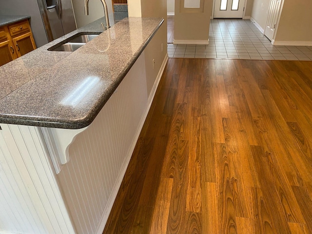 64 Hampton Cir, Niceville, FL 32578 - kitchen featuring dark wood finished floors and dark stone countertops