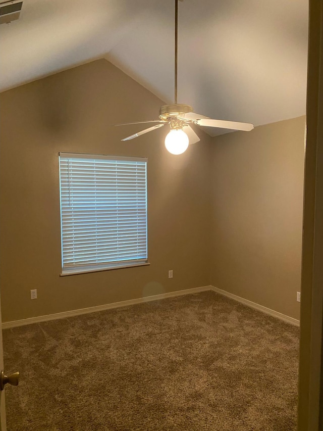 64 Hampton Cir, Niceville, FL 32578 - spare room with ceiling fan, carpet floors, and vaulted ceiling