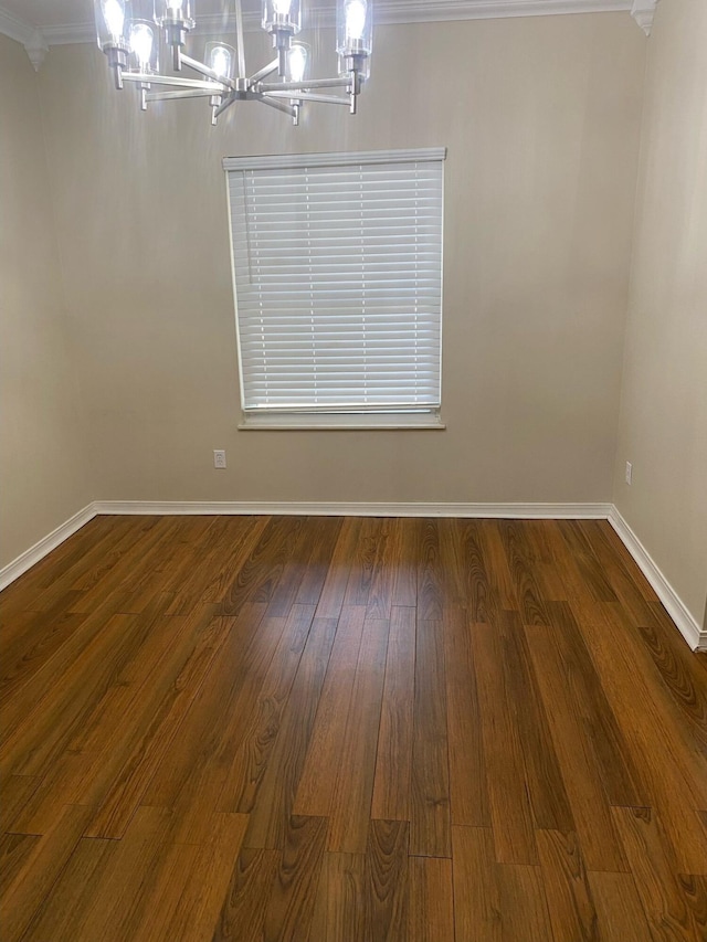 64 Hampton Cir, Niceville, FL 32578 - unfurnished room with a chandelier, wood finished floors, and ornamental molding