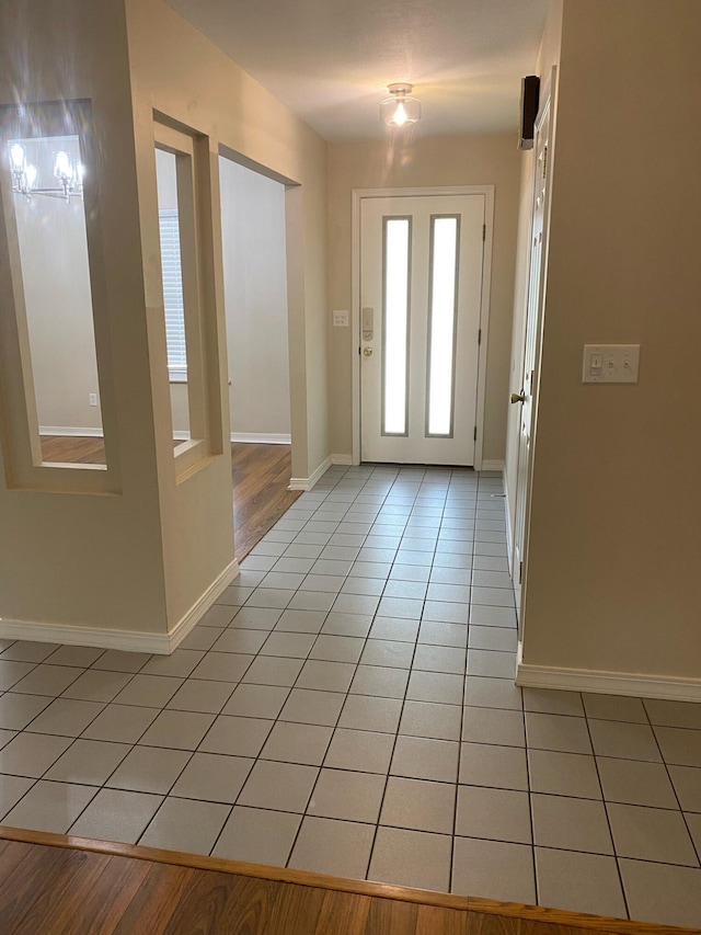 64 Hampton Cir, Niceville, FL 32578 - entryway with light tile patterned floors and baseboards