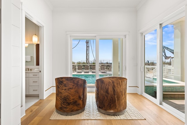17 Palm Court Ln, Inlet Beach, FL 32461 - sitting room featuring light wood-style flooring, plenty of natural light, and crown molding