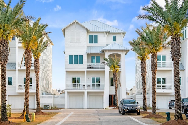 17 Palm Court Ln, Inlet Beach, FL 32461 - view of front of home featuring a standing seam roof, a garage, concrete driveway, and a metal roof