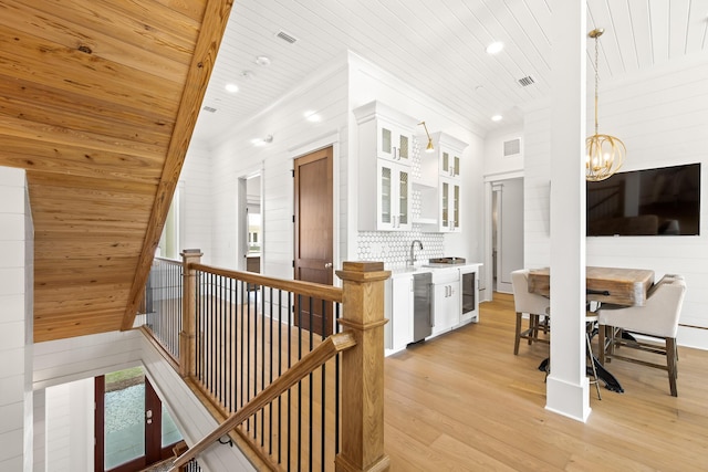 17 Palm Court Ln, Inlet Beach, FL 32461 - hallway featuring wood ceiling, an upstairs landing, a chandelier, light wood finished floors, and recessed lighting