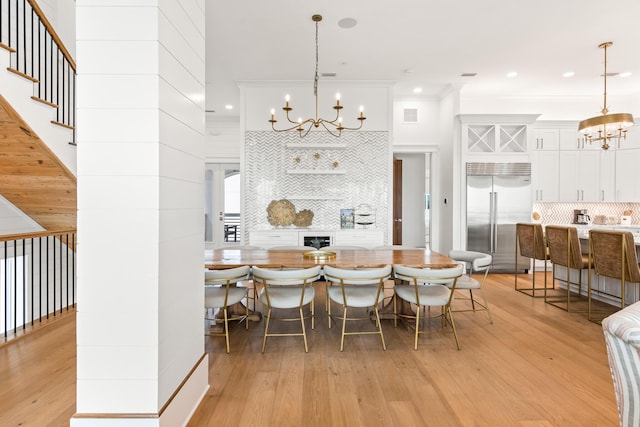 17 Palm Court Ln, Inlet Beach, FL 32461 - dining area with a chandelier, light wood finished floors, ornamental molding, stairway, and recessed lighting