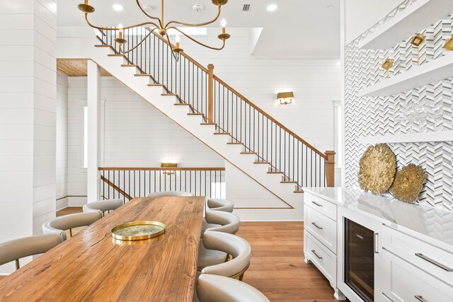 17 Palm Court Ln, Inlet Beach, FL 32461 - living area with light wood-style floors, wine cooler, stairs, a chandelier, and recessed lighting