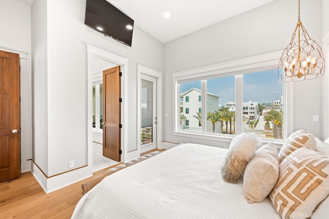 17 Palm Court Ln, Inlet Beach, FL 32461 - bedroom featuring light wood finished floors, recessed lighting, access to outside, a chandelier, and ensuite bathroom