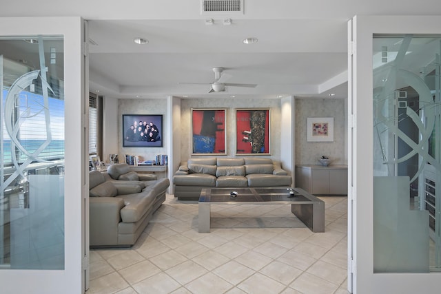514 Gulf Shore Dr Unit 401, Destin, FL 32541 - living room with light tile patterned floors, ceiling fan, a raised ceiling, and recessed lighting
