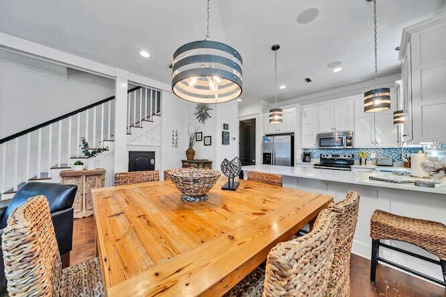 23 The Greenway Loop, Inlet Beach, FL 32461 - dining space featuring stairway, dark wood-style flooring, and recessed lighting