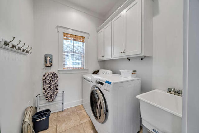 23 The Greenway Loop, Inlet Beach, FL 32461 - laundry area featuring cabinet space, independent washer and dryer, and light tile patterned floors