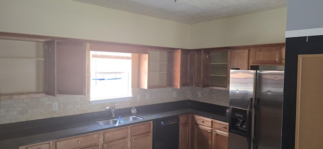 2496 S Lakeview Dr, Crestview, FL 32536 - kitchen featuring stainless steel refrigerator with ice dispenser, black dishwasher, dark countertops, tasteful backsplash, and brown cabinets