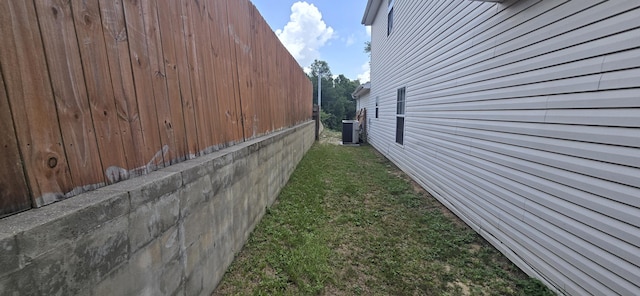2496 S Lakeview Dr, Crestview, FL 32536 - view of side of property featuring a central AC unit and a yard