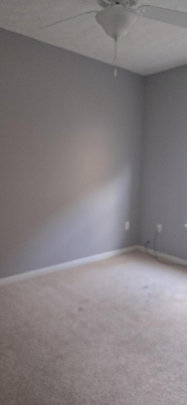 2496 S Lakeview Dr, Crestview, FL 32536 - carpeted empty room featuring a ceiling fan and baseboards