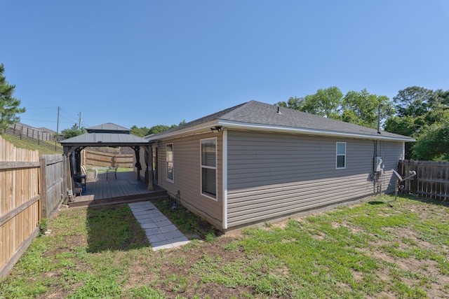 405 Bobby Dr, Crestview, FL 32536 - rear view of property featuring a gazebo, a fenced backyard, a wooden deck, and roof with shingles