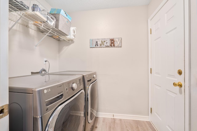 405 Bobby Dr, Crestview, FL 32536 - laundry area with separate washer and dryer and light wood-style floors