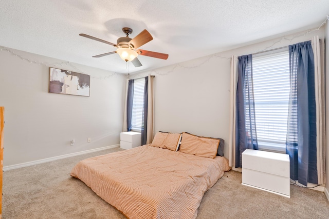 405 Bobby Dr, Crestview, FL 32536 - bedroom featuring light carpet, a textured ceiling, and a ceiling fan