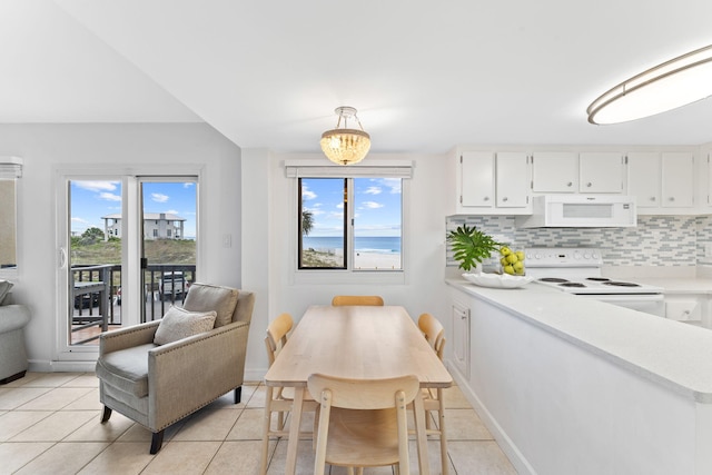 23223 Front Beach Rd # 112, Panama City Beach, FL 32413 - dining area with light tile patterned floors and baseboards