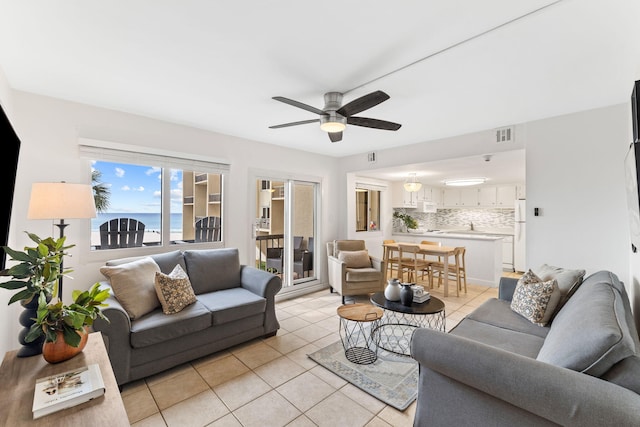 23223 Front Beach Rd # 112, Panama City Beach, FL 32413 - living area with light tile patterned floors and ceiling fan