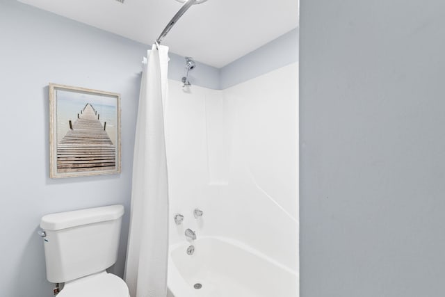 23223 Front Beach Rd # 112, Panama City Beach, FL 32413 - bathroom featuring shower / bath combo with shower curtain and toilet