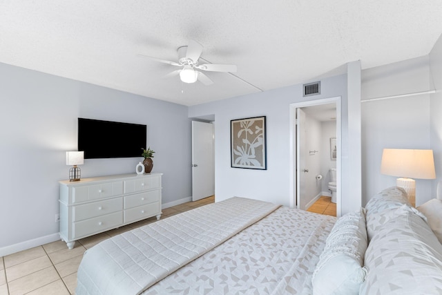 23223 Front Beach Rd # 112, Panama City Beach, FL 32413 - bedroom featuring light tile patterned flooring, a ceiling fan, and connected bathroom