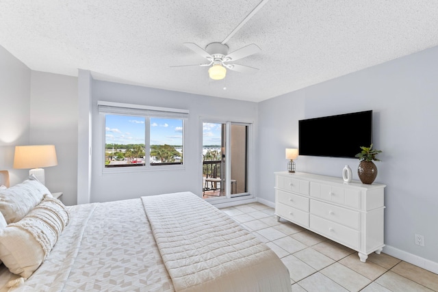 23223 Front Beach Rd # 112, Panama City Beach, FL 32413 - bedroom with access to outside, light tile patterned flooring, ceiling fan, and a textured ceiling