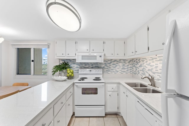 23223 Front Beach Rd # 112, Panama City Beach, FL 32413 - kitchen with white appliances, light tile patterned floors, and white cabinets