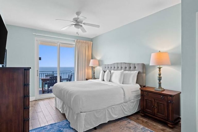 16701 Front Beach Rd Unit 1807, Panama City Beach, FL 32413 - bedroom with access to exterior, wood finished floors, ceiling fan, and a water view