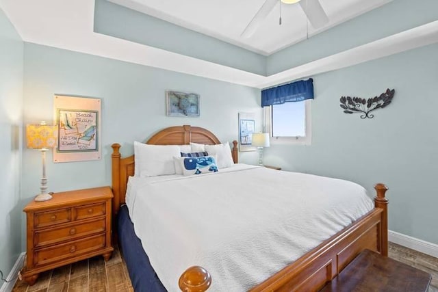 16701 Front Beach Rd Unit 1807, Panama City Beach, FL 32413 - bedroom featuring wood finished floors, a ceiling fan, and a raised ceiling