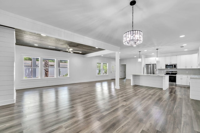 2672 Chat Holley Rd, Santa Rosa Beach, FL 32459 - unfurnished living room with recessed lighting, dark wood-type flooring, a chandelier, and a ceiling fan