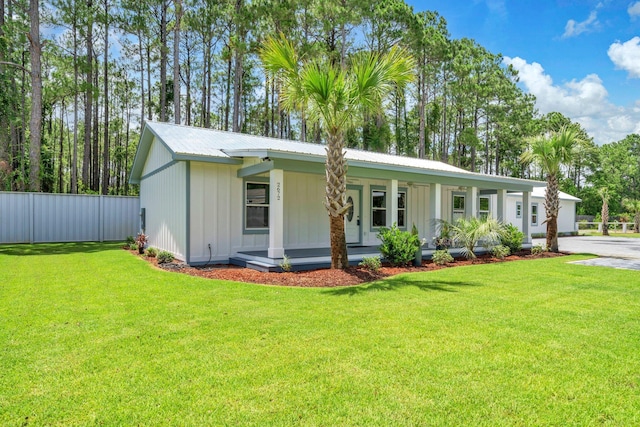 2672 Chat Holley Rd, Santa Rosa Beach, FL 32459 - view of front facade featuring covered porch, board and batten siding, and a metal roof