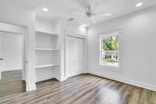 2672 Chat Holley Rd, Santa Rosa Beach, FL 32459 - unfurnished bedroom featuring wood finished floors, a closet, recessed lighting, and ceiling fan