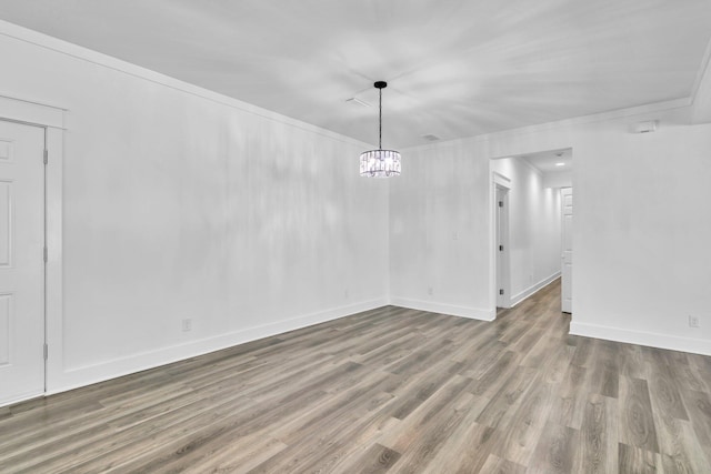 2672 Chat Holley Rd, Santa Rosa Beach, FL 32459 - unfurnished dining area featuring wood finished floors, a chandelier, and crown molding