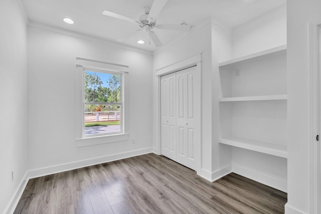 2672 Chat Holley Rd, Santa Rosa Beach, FL 32459 - unfurnished bedroom featuring wood finished floors, a closet, recessed lighting, and a ceiling fan