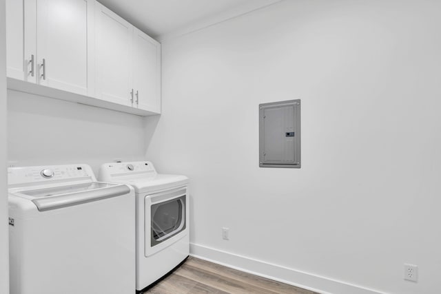 2672 Chat Holley Rd, Santa Rosa Beach, FL 32459 - washroom with electric panel, independent washer and dryer, cabinet space, and wood finished floors