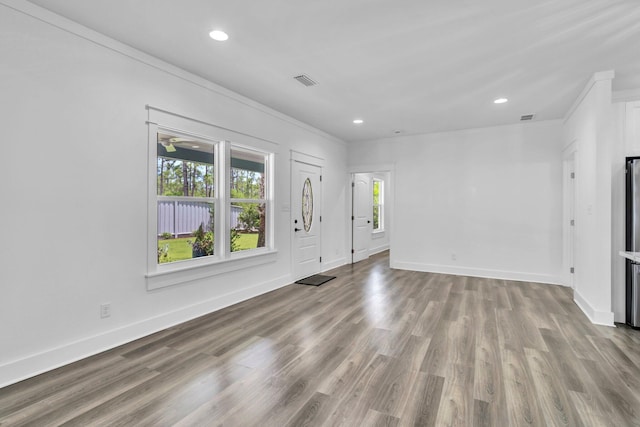 2672 Chat Holley Rd, Santa Rosa Beach, FL 32459 - unfurnished living room with crown molding, recessed lighting, and wood finished floors