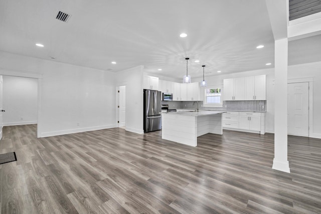 2672 Chat Holley Rd, Santa Rosa Beach, FL 32459 - unfurnished living room featuring recessed lighting and wood finished floors