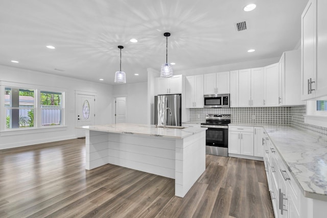 2672 Chat Holley Rd, Santa Rosa Beach, FL 32459 - kitchen featuring stainless steel appliances, backsplash, light stone countertops, dark wood-style floors, and recessed lighting