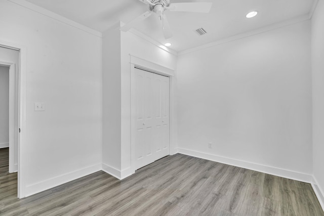 2672 Chat Holley Rd, Santa Rosa Beach, FL 32459 - unfurnished bedroom with crown molding, light wood-style floors, a closet, recessed lighting, and a ceiling fan