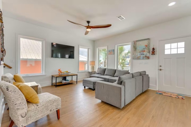 7411 Grand Navarre Blvd, Navarre, FL 32566 - living room featuring healthy amount of natural light, ceiling fan, light wood-style flooring, and recessed lighting