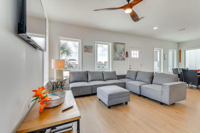 7411 Grand Navarre Blvd, Navarre, FL 32566 - living area with healthy amount of natural light, light wood-type flooring, a ceiling fan, and recessed lighting