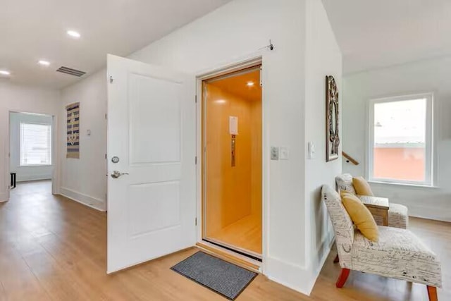 7411 Grand Navarre Blvd, Navarre, FL 32566 - entrance foyer featuring light wood-style floors and recessed lighting