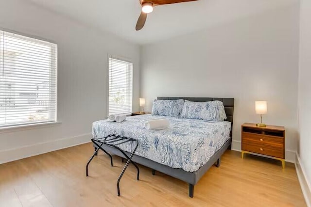 7411 Grand Navarre Blvd, Navarre, FL 32566 - bedroom featuring light wood-style flooring and a ceiling fan