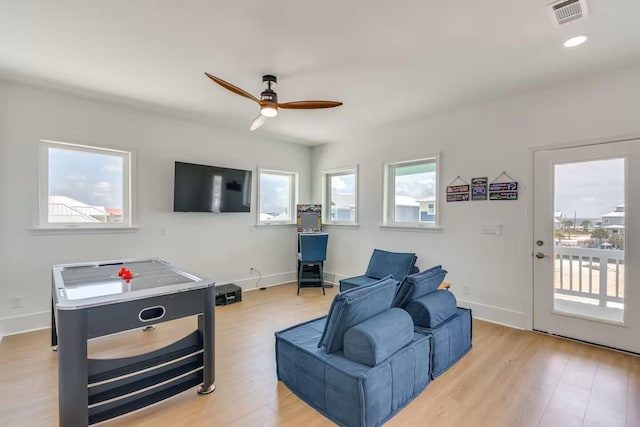 7411 Grand Navarre Blvd, Navarre, FL 32566 - living area with a ceiling fan, light wood-type flooring, and recessed lighting