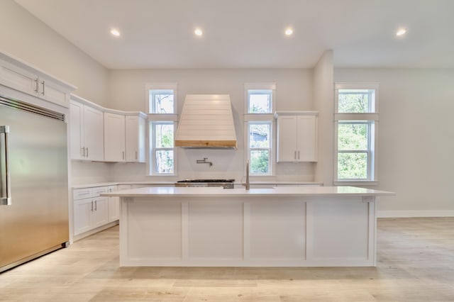 116 E Georgie Pt, Washington, FL 32459 - kitchen featuring stainless steel built in refrigerator, custom exhaust hood, light countertops, a kitchen island with sink, and recessed lighting