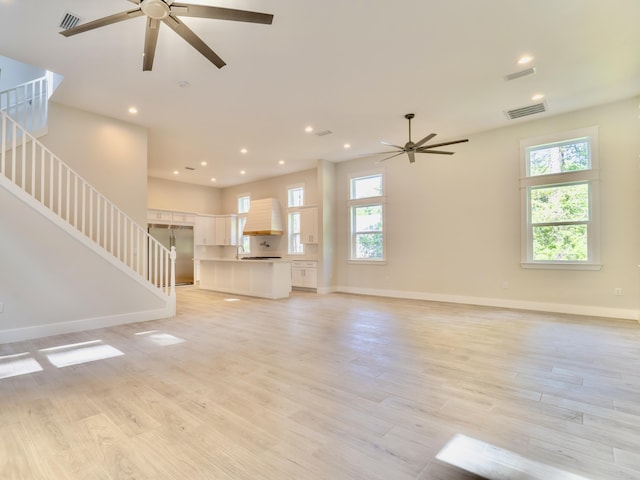 116 E Georgie Pt, Washington, FL 32459 - unfurnished living room with ceiling fan, healthy amount of natural light, light wood finished floors, and recessed lighting